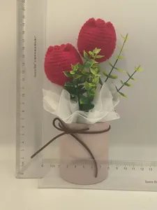 Handcrafted knitted tulip flower bouquet in pot, cute crochet desktop decoration gift.