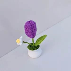 Handmade crochet purple tulip potted plant, exquisite yarn flower decor for home desktop.