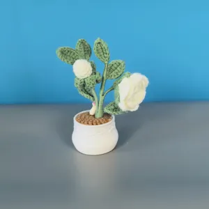 Handcrafted white crochet rose potted plant detail view, perfect for cozy home decor aesthetics.