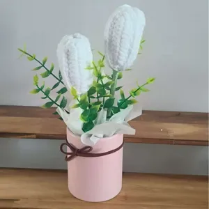 Handmade crochet white tulip flower in pink pot, detailed view of potted knit floral decor gift.