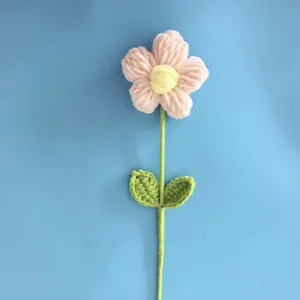 Handmade crochet wool yarn flower detail view, artificial puff flower bouquet decoration.