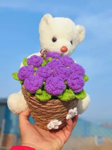 Handmade crochet bear flower bouquet detail, cute wool knitted rose basket ornament.