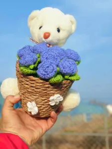 Handmade crochet white bear flower bouquet detail shot, perfect cute gift ornament display.