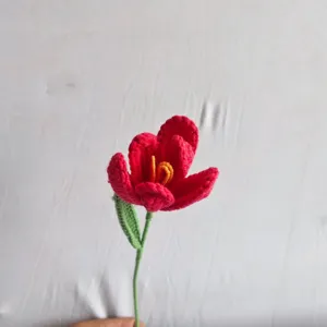 Handmade crochet yarn tulip flower detail, exquisite knitted floral bouquet gift for home decor.