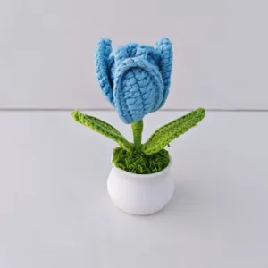 Handcrafted crochet blue tulip potted plant detail, cute wool flower decor for home desk.