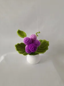 Handmade crochet grape potted plant, cute purple wool knitted fruit decor for desktop.