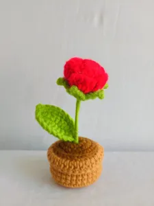 Handcrafted crochet rose flower pot detail shot, perfect for cute home desk or car interior decor.