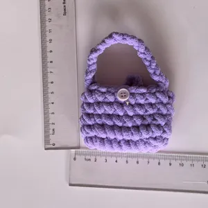 Handcrafted purple crochet mini plush handbag coin purse detail view showing actual size.