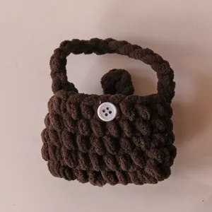 Handcrafted crochet plush mini handbag brown coin purse cute earphone case for daily use.