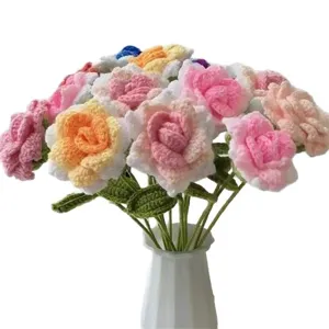 Handmade crochet rose bouquet, knitted wool floral arrangement in vase for home decor.