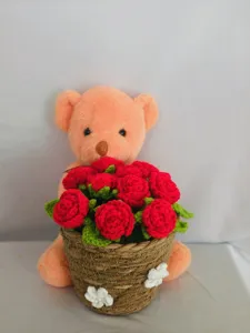 Handcrafted crochet rose bouquet with cute plush bear detail, perfect gift decor.