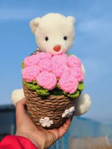 Handmade knitted crochet bear flower bouquet in woven basket, perfect birthday gift.