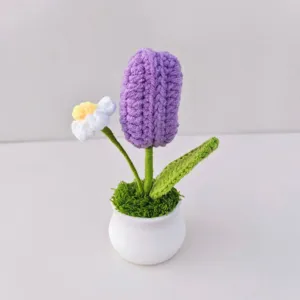 Handcrafted crochet tulip potted detail, fine woolen yarn texture, charming home decor accent.