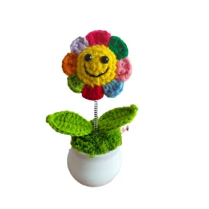 Handmade crocheted colorful smiley flower potted ornament, cute desktop home decor plant.
