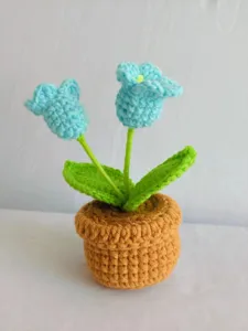 Handcrafted crochet double-head lily potted plant detail view, perfect home decor gift.