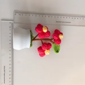 Handmade crochet wool flower potted plant, knitted floral desktop ornament for home decor.