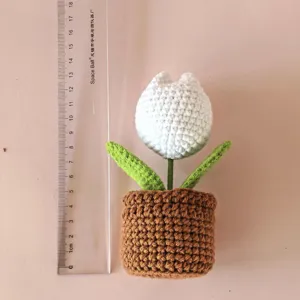 Handmade crochet white tulip potted plant detail showing neat stitches and cute desktop decor.