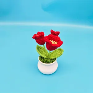 Handmade crochet red flower potted plant detail view, perfect for cozy desktop decoration.