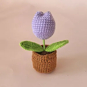 Handmade crochet potted tulip flower ornament, cute purple knit floral desk decor for home.