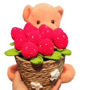 Handmade crochet hugging bear with strawberry potted plant, cute home decor gift for birthday.
