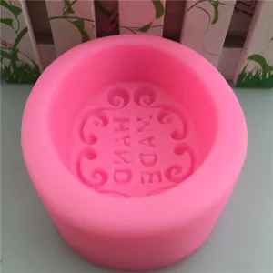 Pink round silicone mold for handmade soap, resin, and candle making with retro texture.