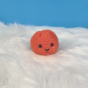Handgemaakt gehaakt smiley oranje broodje anti-stress speelgoed schattige pluizige achtergrond