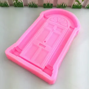 Detail shot of a pink silicone door mold, perfect for fondant, cake decorating, and crafts.