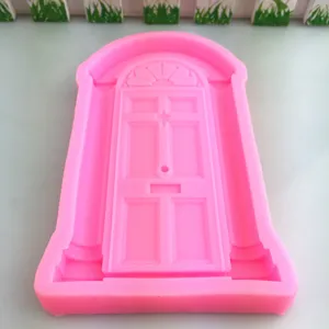 Pink silicone door mold for cake decorating, fondant craft and baking mould detail view.