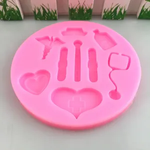 Pink silicone mold with medical nurse theme shapes for baking chocolate cake decoration tools.
