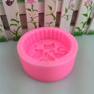 Pink silicone mold for cat lovers, baking, fondant, and soap making with cute heart and bow design.