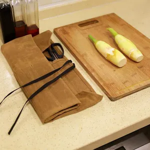 Waxed canvas chef knife roll bag for camping and outdoor cooking portable tool storage organizer.