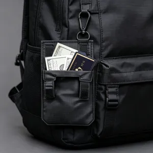 Black tactical backpack with modular pouch, durable nylon material for travel and daily use.