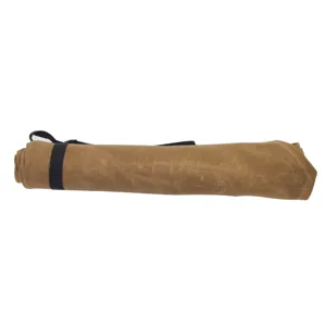 Detail view of the rolled waterproof waxed canvas knife bag, portable storage design.