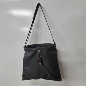 Outdoor fruit picking bag detail view: black oxford bag with quick release buckle.
