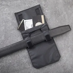 Black tactical belt pouch detail showing card slots and storage space for travel use.