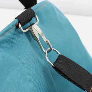 Detailed view of waterproof oxford cloth fruit picking bag with metal hook and strap.