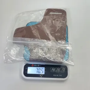 Brown leather tool sheath and tactical waist holster detail showing product weight in transparent bag.