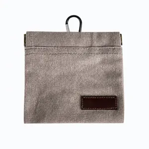 Portable dog treat training pouch with carabiner grey canvas bag for outdoor pet walking.