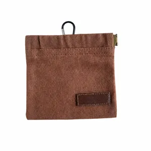 Portable canvas pet treat pouch with carabiner and spring frame, brown snack training bag.