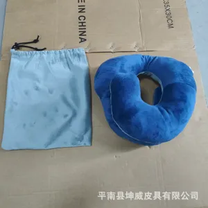Blue U-shaped travel neck pillow with storage bag, soft plush support for office and flight.