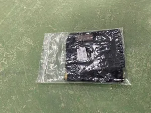 Detail view of portable black pet treat bag for outdoor dog training with metal carabiner