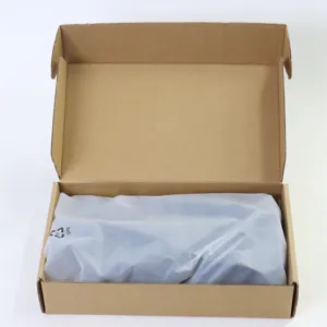 Camera strap packaging detail featuring durable brown cardboard box and protective CPE bag.