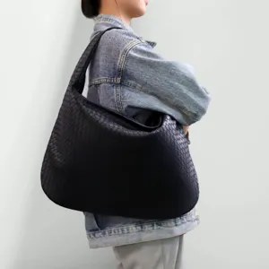 Handwoven black leather shoulder bag, chic underarm hobo crescent design for daily wear.
