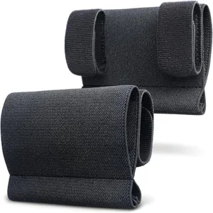 Close-up view of black tactical tourniquet holder strap with velcro for outdoor gear.
