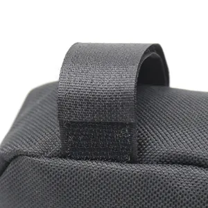 Durable black bicycle bag strap detail, waterproof mountain bike frame bag accessory.