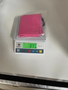 Dog waterproof bathing cap detail view showing product weight of 37.3g on scale for clarity.