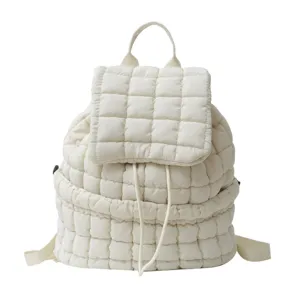 Detailed view of white quilted puffer backpack, soft grid texture, modern minimalist daily bag.