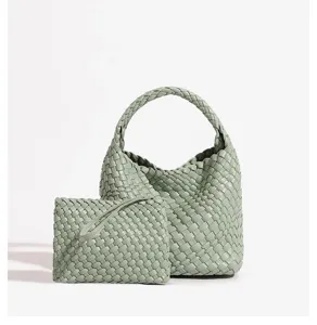 Green woven leather handbag set with matching clutch, elegant design for women daily commute.