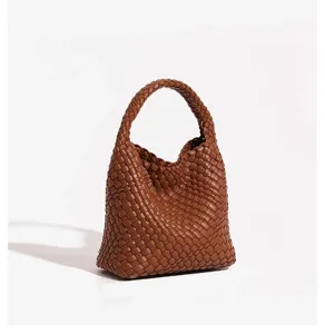 Brown leather woven handbag detail, stylish hobo tote bag for daily commute and vacation use.