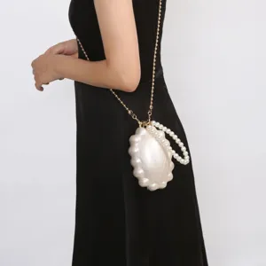 Elegant pearl shell evening bag with chain strap and handle for women's luxury party wear.